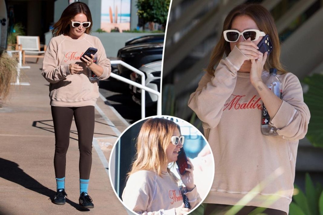 See photos of Ashley Tisdale’s  somber phone conversation as ‘toxic’ mom group drama continues