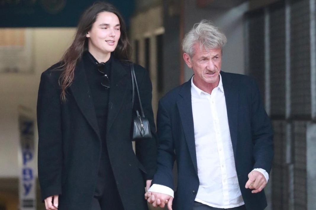 Sean Penn, 65, and much-younger girlfriend, 30, hold hands on rare public outing after Golden Globes