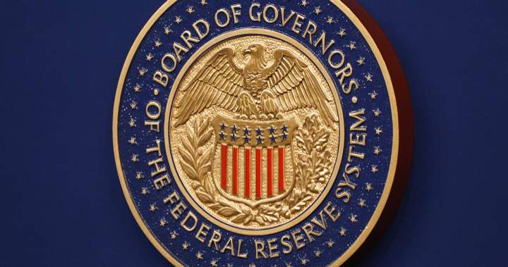U.S. Federal Reserve holds interest rates as pressure from Trump mounts