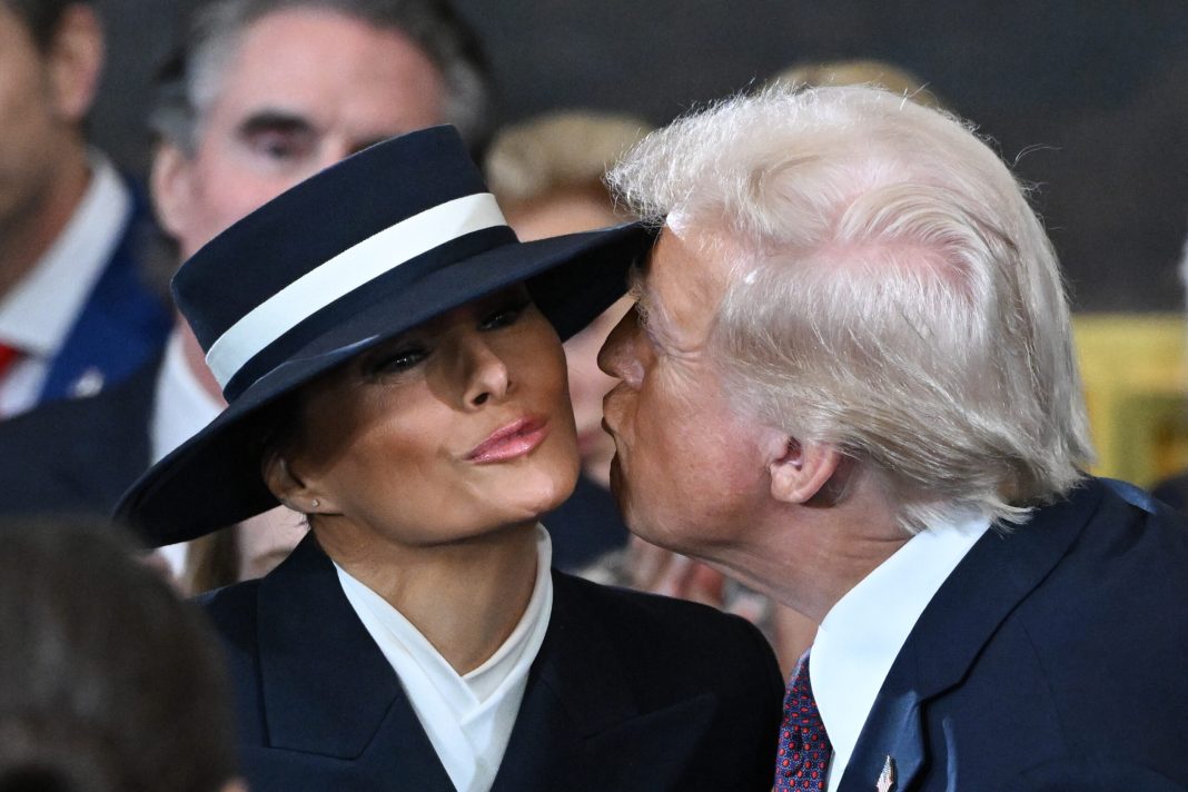 U.S. President-elect Donald Trump kisses Melania Trump at his inauguration in the U.S. Capitol Rotunda on January 20, 2025 in Washington, DC. 