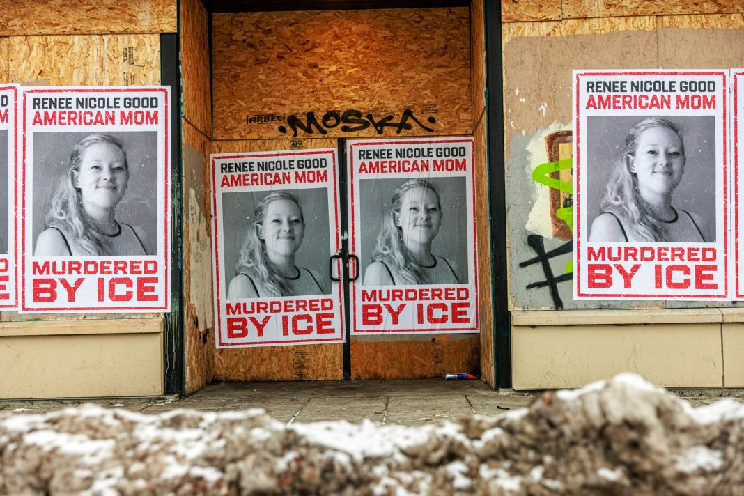 Businesses boarded up in parts of Minneapolis display posters of Renee Nicole Good on plywood-covered windows following her fatal shooting by an ICE agent, in Minneapolis, Minnesota, on January 11, 2026. 
