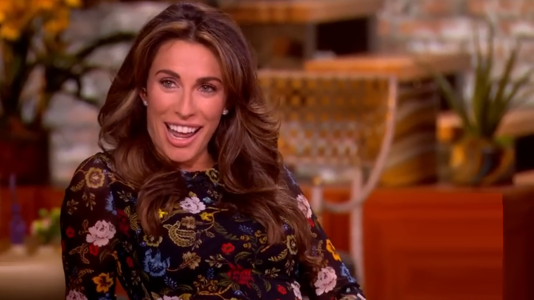 Alyssa Farah Griffin smiles and cups her baby bump on The View.