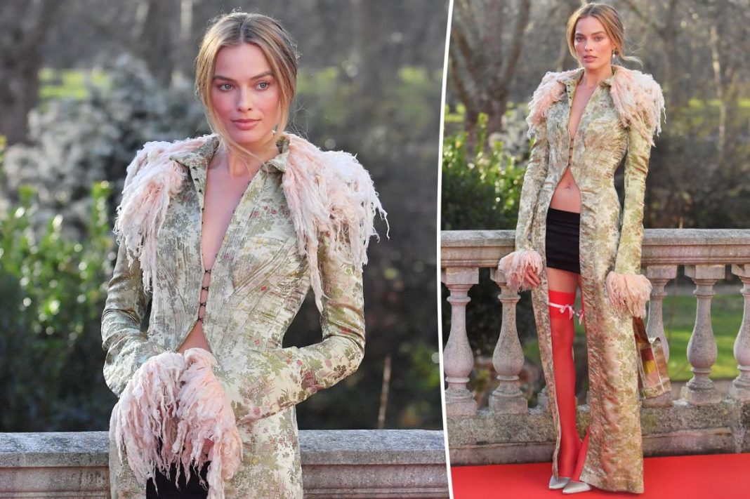 Margot Robbie’s latest ‘Wuthering Heights’ look has it all: Thigh-highs, a bare midriff and a micro-mini