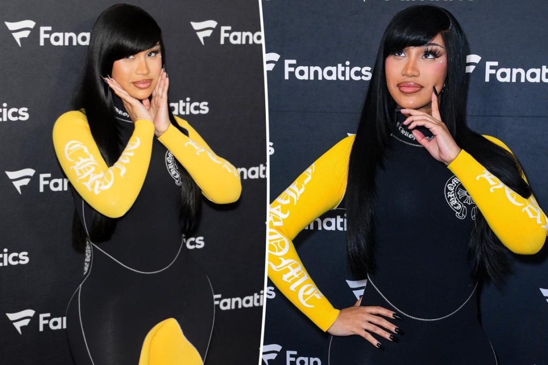 Cardi B takes a tumble while giving a robot a lap dance