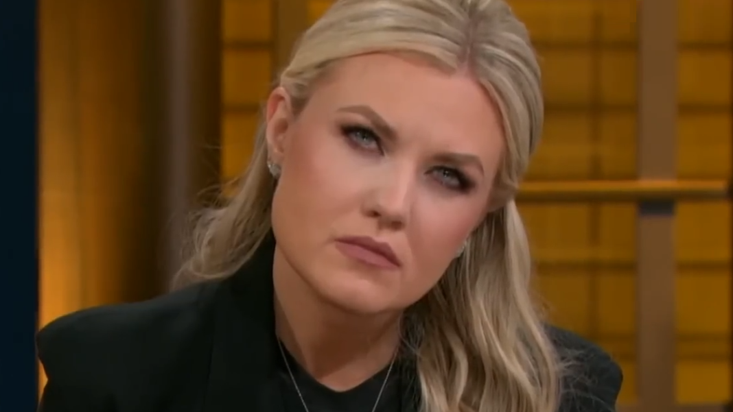 Erika Kirk tilts her head to the side.