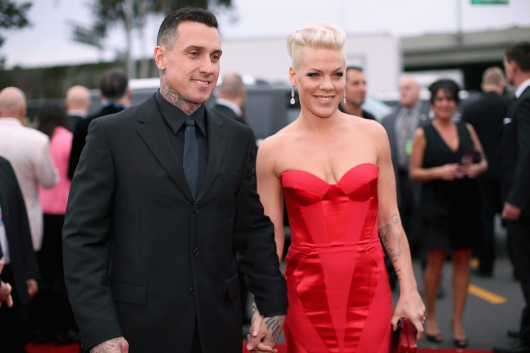 Off-road truck racer Carey Hart and singer Pink attend the 56th GRAMMY Awards at Staples Center on January 26, 2014 in Los Angeles, California.  