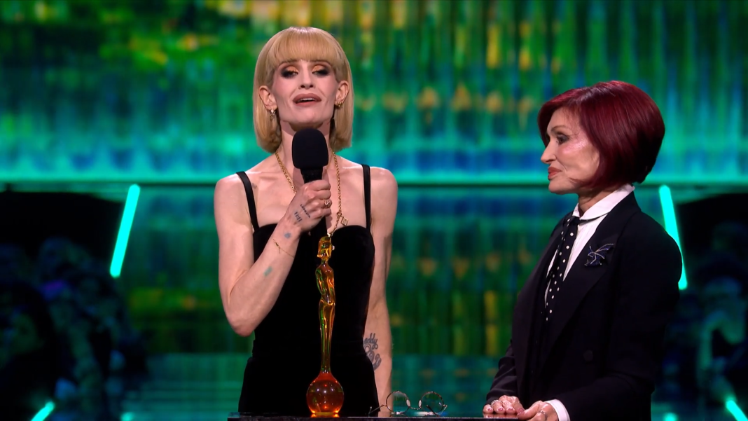 Kelly Osbourne speaks while Sharon watches at the BRIT Awards 2026.