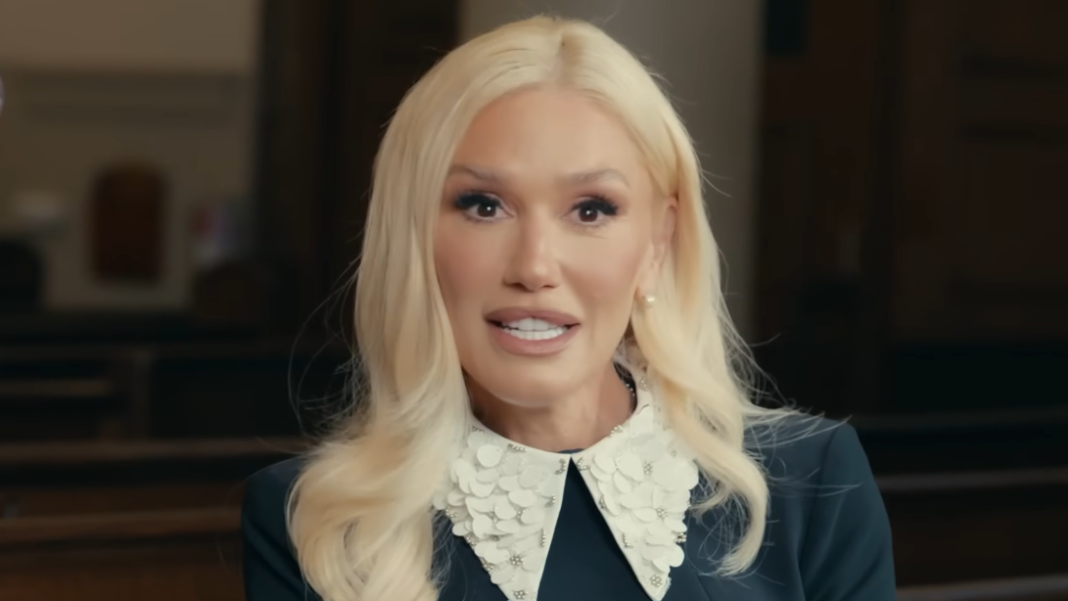 Gwen Stefani looks into the camera in a church