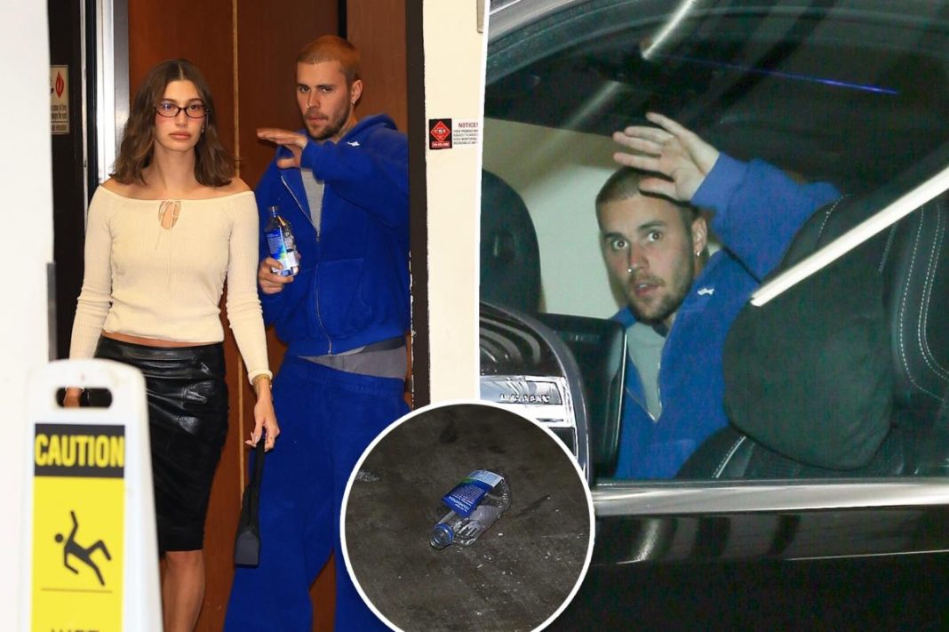 Justin Bieber hurls water bottle at paparazzi following sushi date with wife Hailey