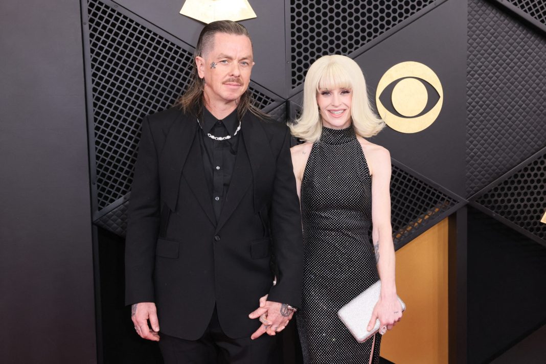 US DJ Sid Wilson and English TV personality Kelly Osbourne arrive for the 68th Annual Grammy Awards at the Crypto.com Arena in Los Angeles on February 1, 2026. 