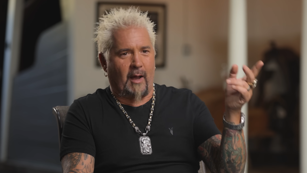 Guy Fieri speaks in an interview.