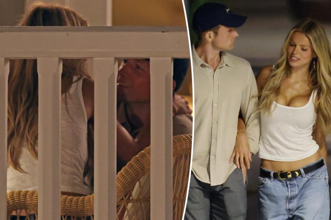 Taron Egerton can’t keep his hands — or lips — off Brooks Nader during steamy beachside date